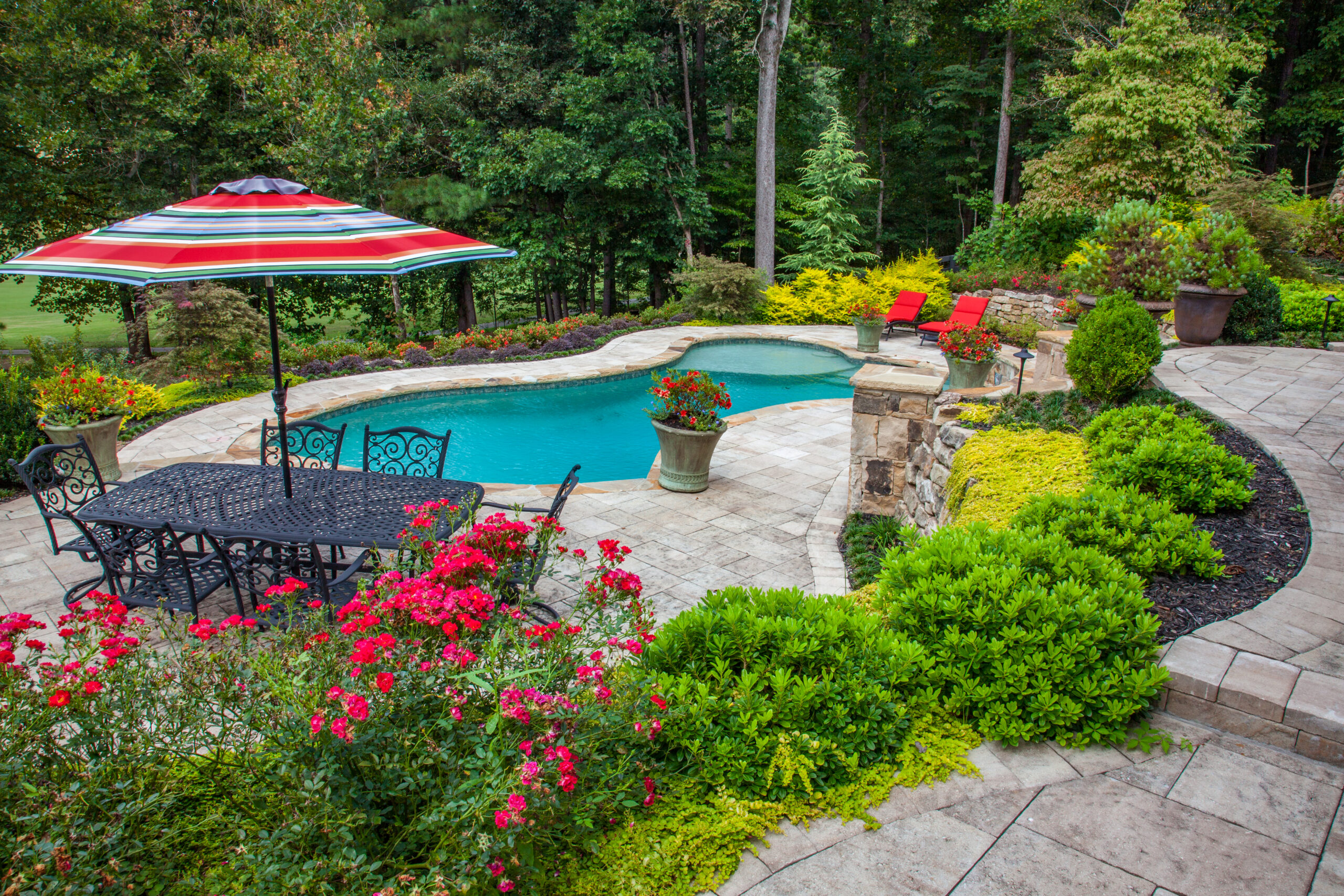 Gorgeous landscaping surrounding a turquoise pool