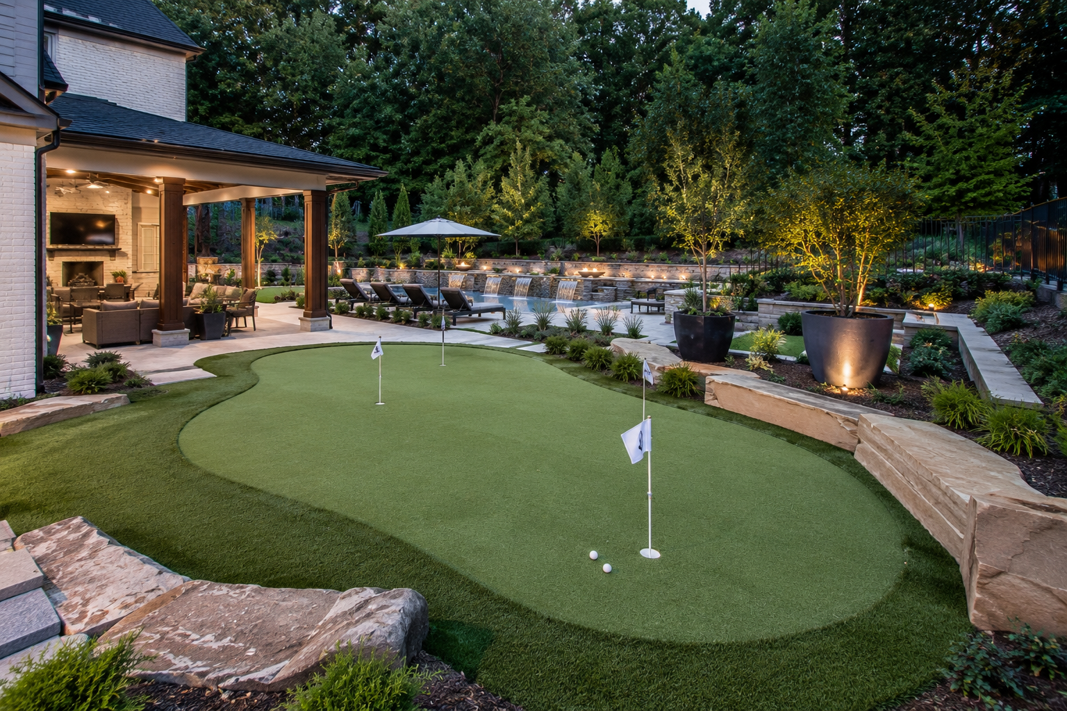 Low-maintenance North Atlanta backyard with artificial turf, planting beds, and stone path